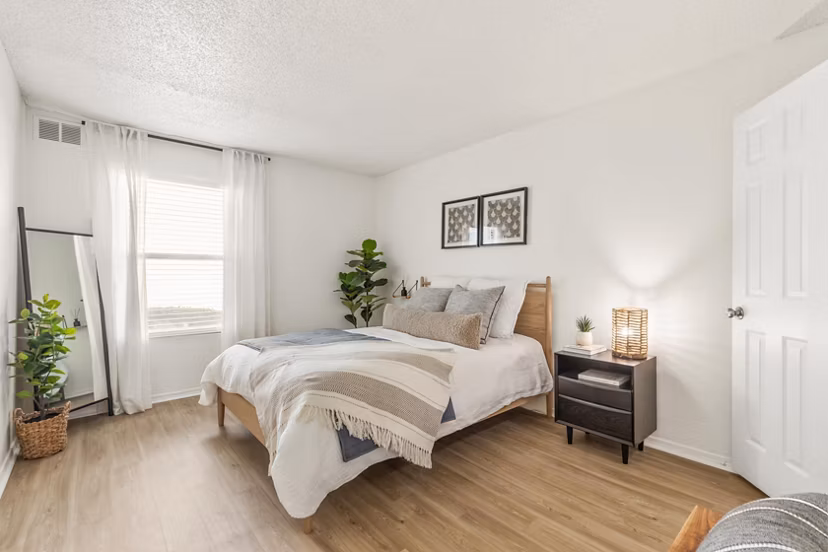 Spacious bedroom with modern design elements in Cascades at Southern Hills Apartments
