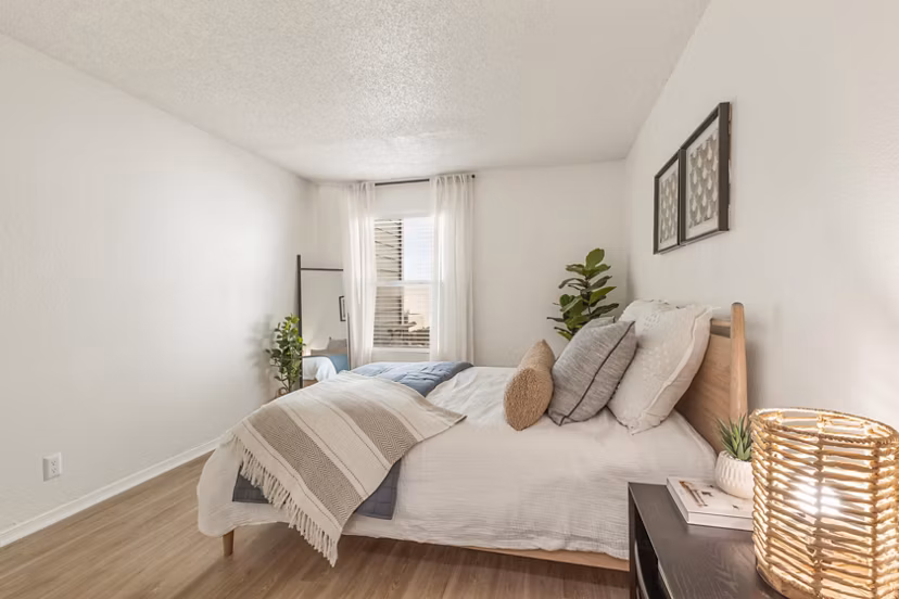 Spacious bedroom with natural light at Cascades at Southern Hills Apartments