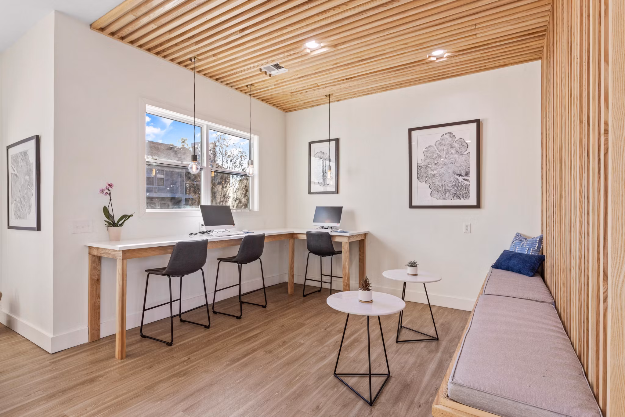 Clubhouse featuring modern design and comfy seating at Cascades at Southern Hills Apartments