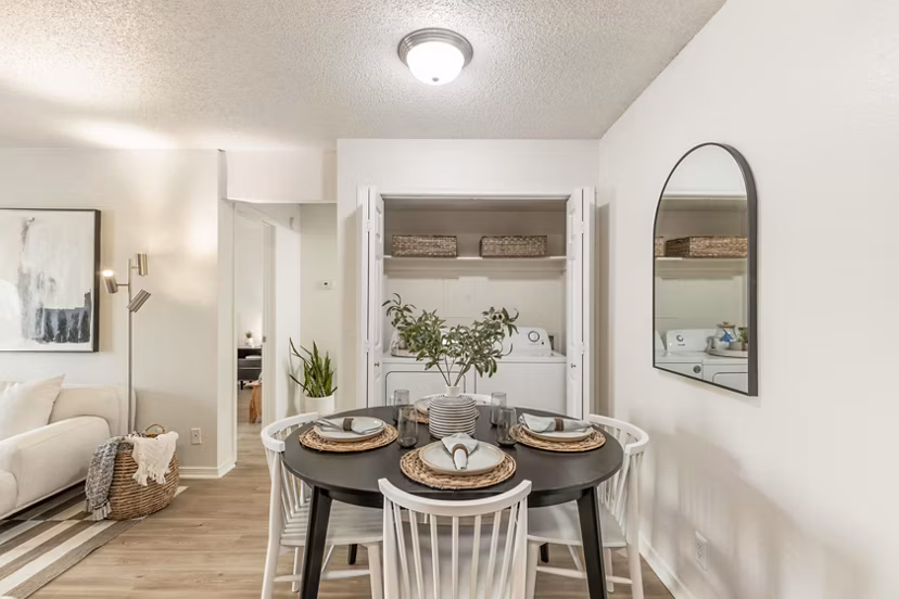 Dining area with modern decor and natural lighting in Cascades at Southern Hills Apartments