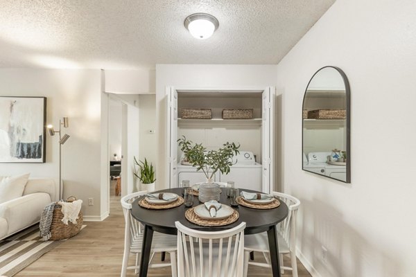 Dining area with modern decor and natural lighting in Cascades at Southern Hills Apartments