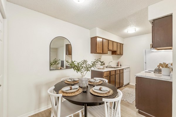 Dining area featuring modern decor and ample natural light at Cascades at Southern Hills Apartments