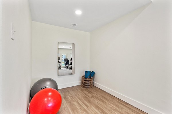 Modern yoga and spin studio at Cascades at Southern Hills Apartments offering residents wellness facilities