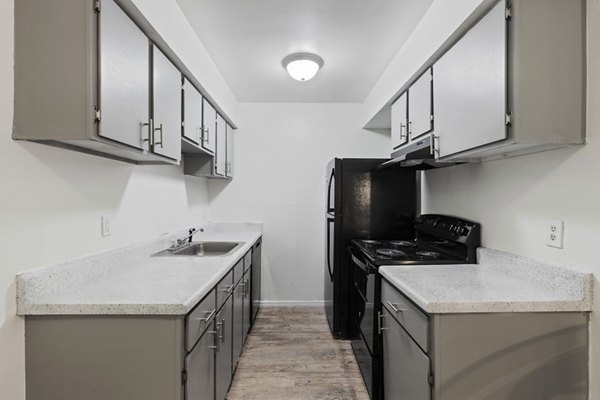 Spacious kitchen with modern appliances at Cascades at Southern Hills Apartments