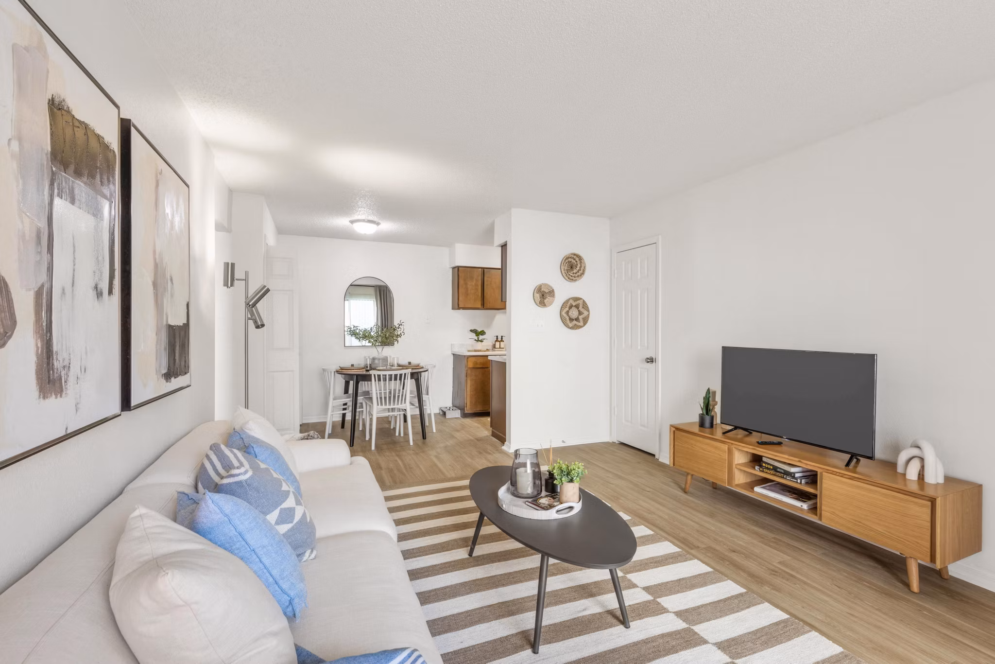 Living room in Cascades at Southern Hills Apartments featuring stylish furniture and large windows, offering a luxurious lifestyle