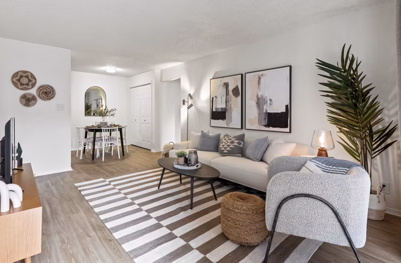 Stylish living room with plush seating and modern decor at Cascades at Southern Hills Apartments, Greystar luxury apartments