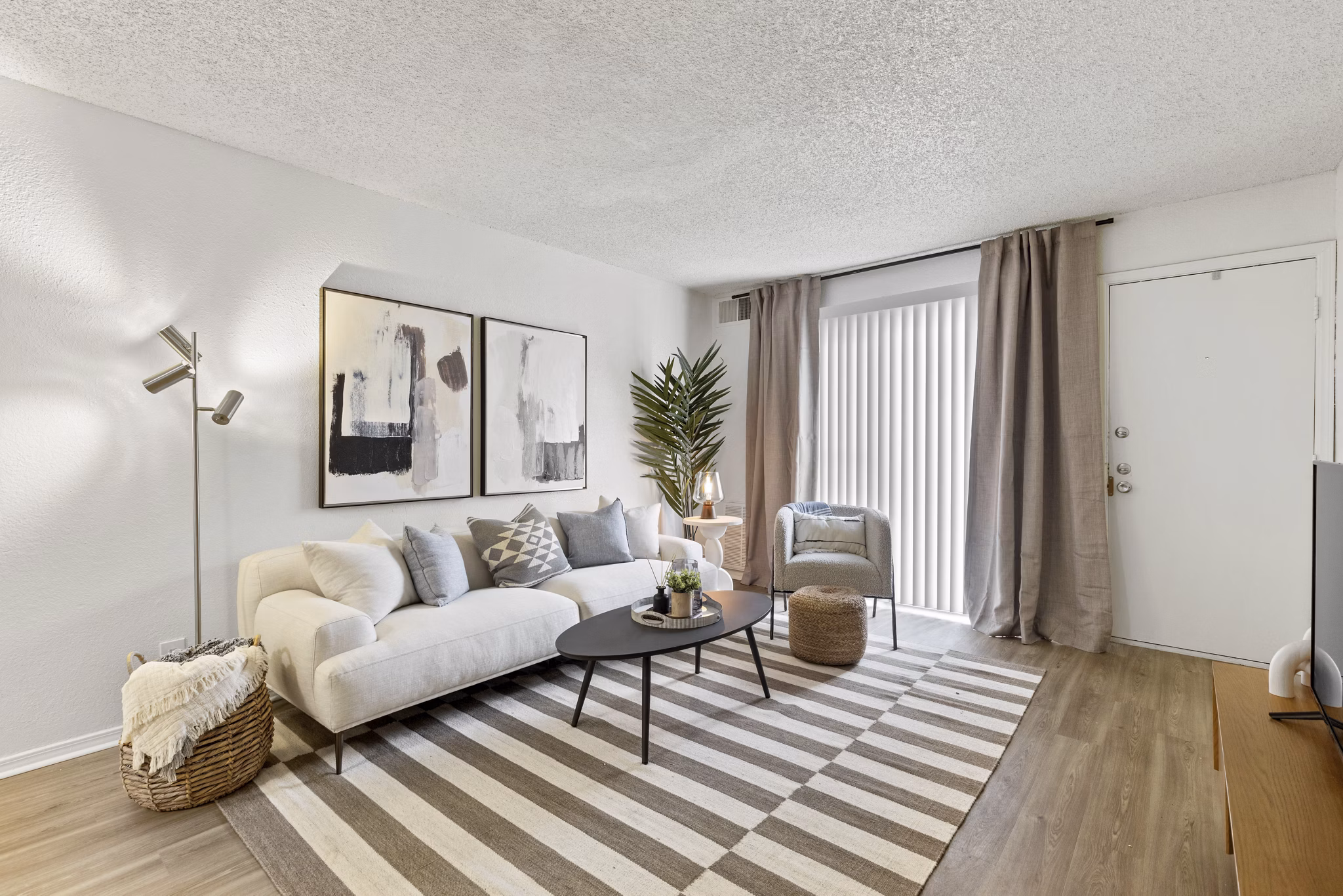 Spacious living room with modern decor in Cascades at Southern Hills Apartments