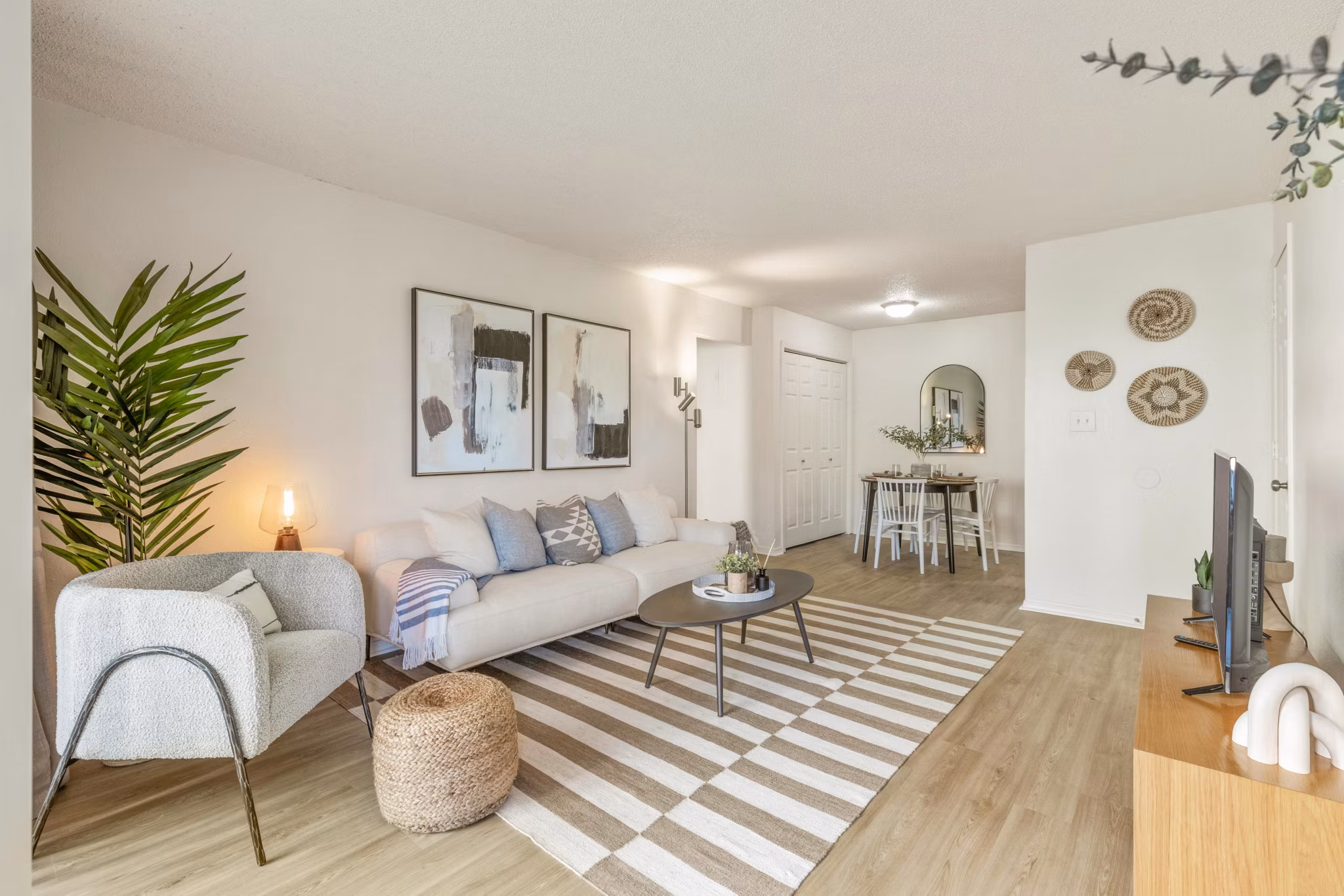 Contemporary living room with cozy furnishings at Cascades at Southern Hills Apartments in Tulsa, perfect for relaxation and comfort