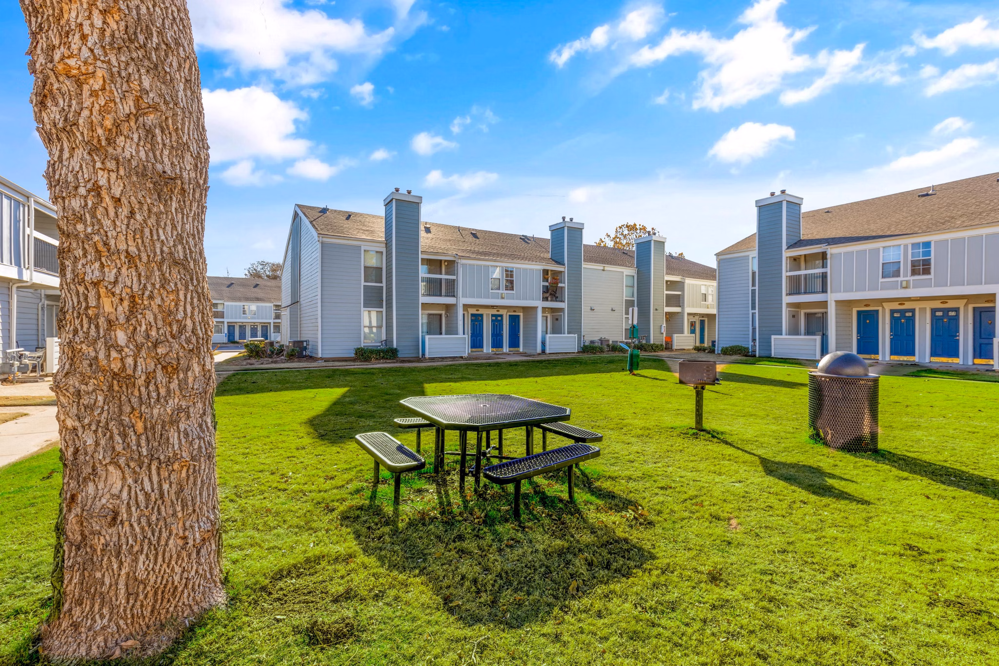 Grill area with modern seating at Cascades at Southern Hills Apartments