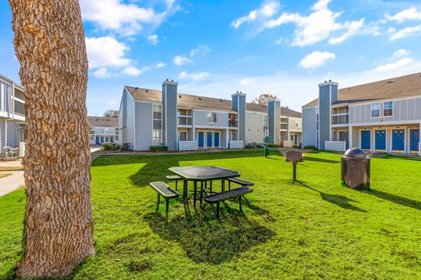 Grill area with modern seating at Cascades at Southern Hills Apartments