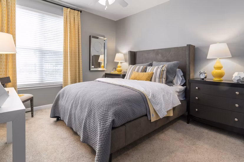 Spacious bedroom featuring modern design and ample natural light at Oberlin Court Apartments luxury apartments