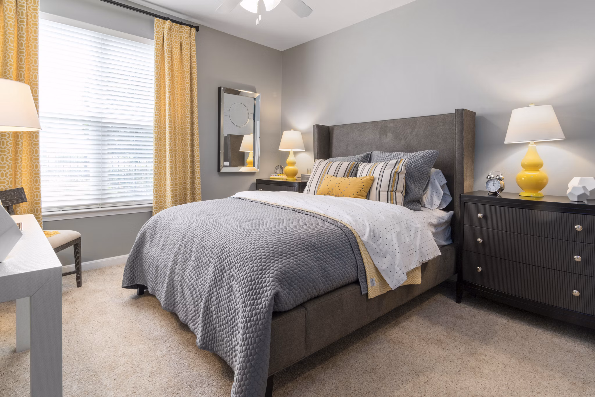 Spacious bedroom featuring modern design and ample natural light at Oberlin Court Apartments luxury apartments