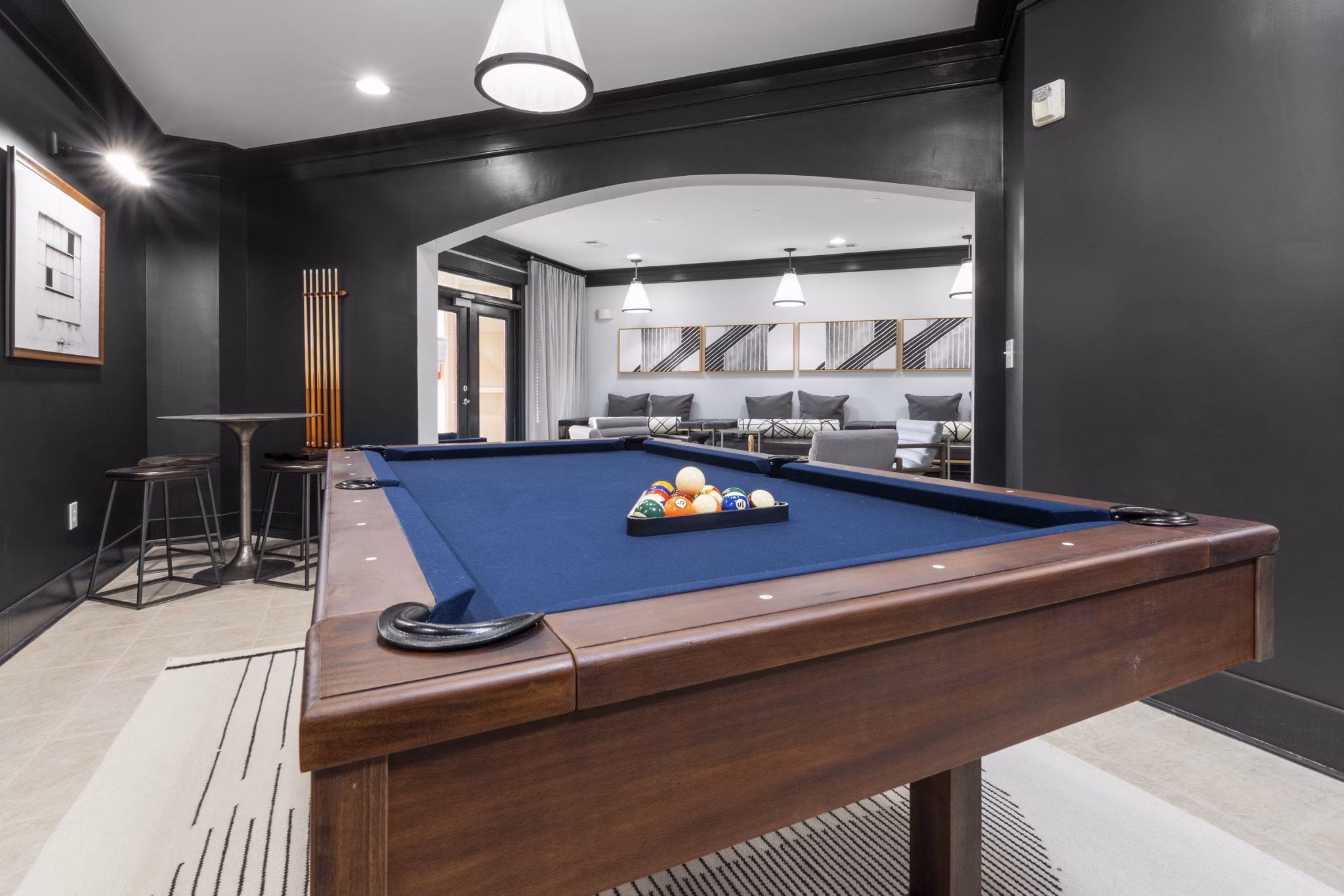 Vibrant game room with pool table and lounge seating at Oberlin Court Apartments, perfect for social gatherings and entertainment