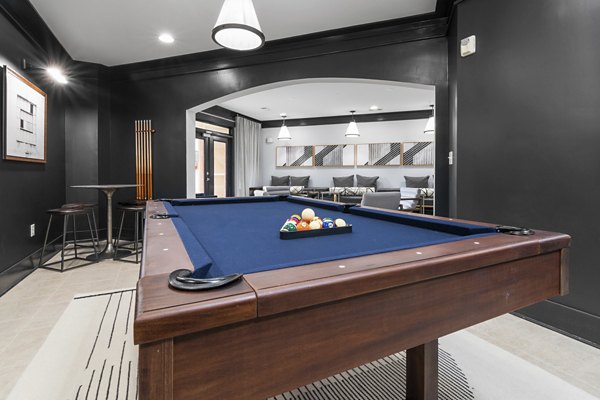 Vibrant game room with pool table and lounge seating at Oberlin Court Apartments, perfect for social gatherings and entertainment