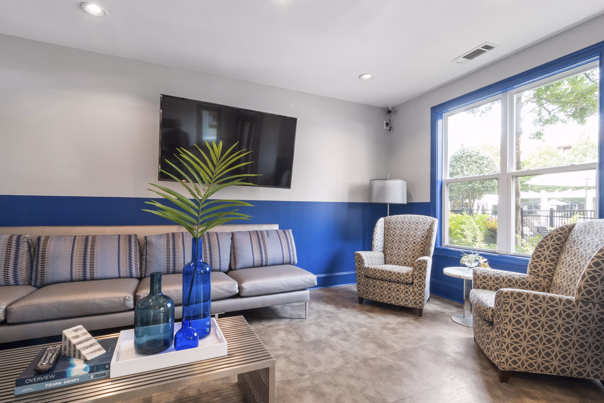 Modern clubhouse featuring cozy lounge seating and a fireplace at Oberlin Court Apartments, perfect for luxury living