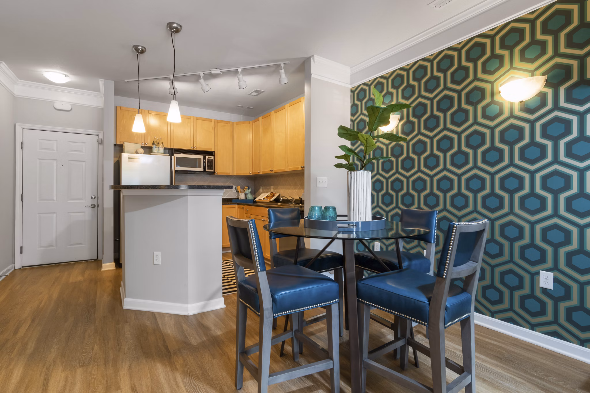 Dining area featuring modern furniture and hardwood floors at Oberlin Court Apartments, luxury living in a vibrant community