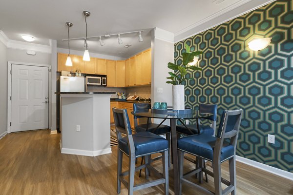 Dining area featuring modern furniture and hardwood floors at Oberlin Court Apartments, luxury living in a vibrant community