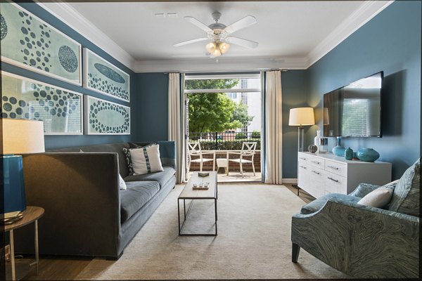 Spacious modern living room with sleek furnishings at Oberlin Court Apartments, featuring natural light and elegant decor
