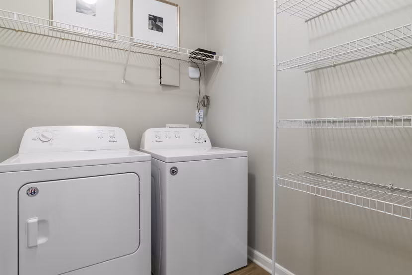 Laundry room with modern appliances in Oberlin Court Apartments, a luxurious Greystar luxury apartment community
