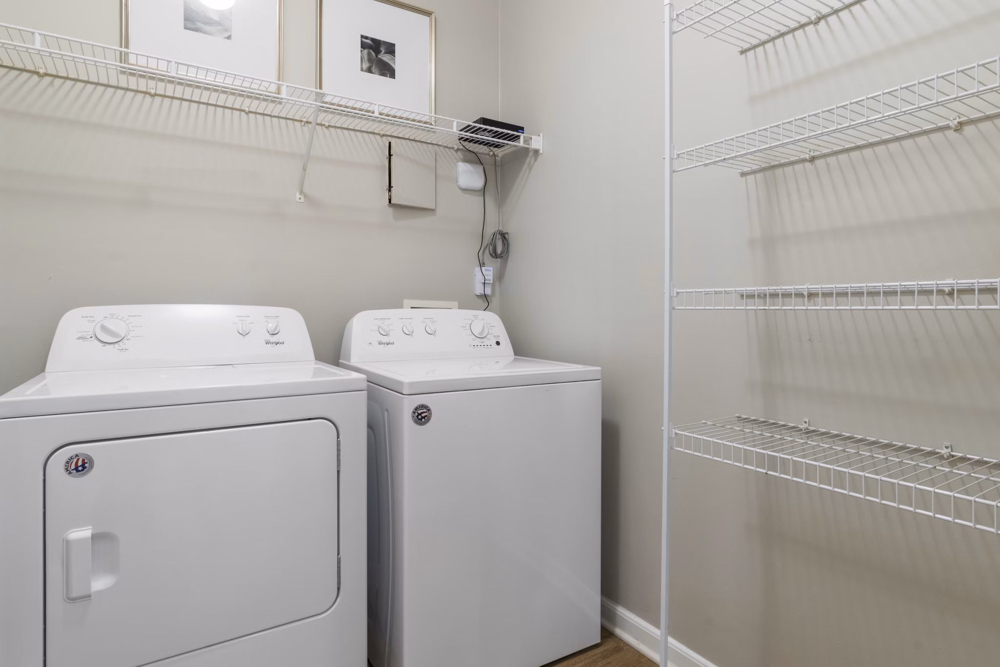Laundry room with modern appliances in Oberlin Court Apartments, a luxurious Greystar luxury apartment community