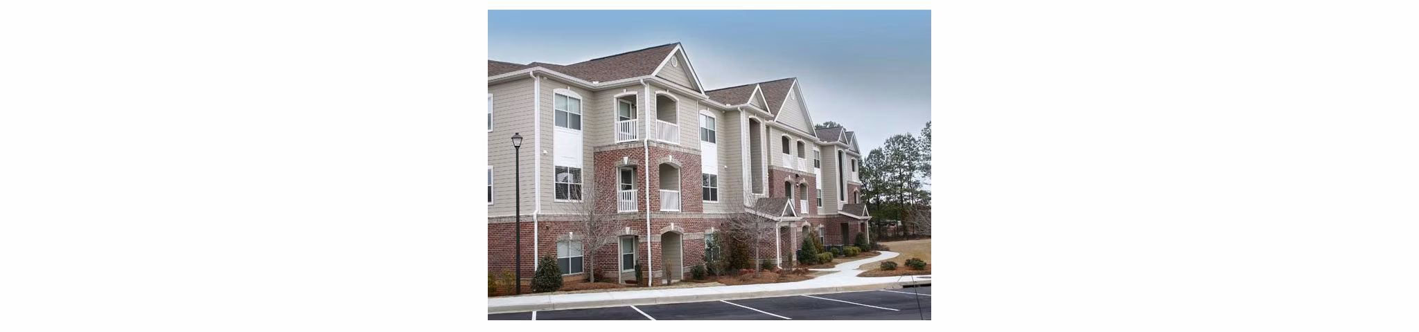 Villas at Loganville: Elegant of luxury apartments in Loganville, showcasing manicured landscaping and contemporary design