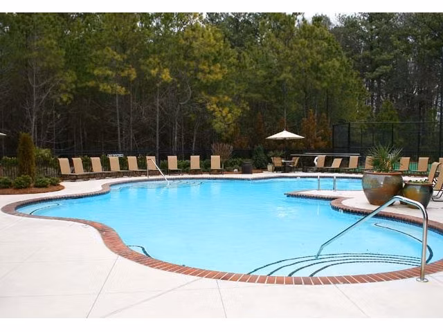 Luxurious outdoor pool at Villas at Loganville, perfect for relaxation and leisure activities in a serene environment