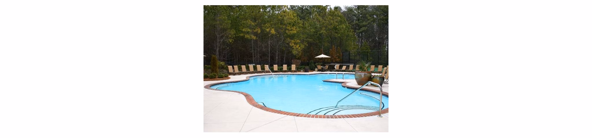 Luxurious outdoor pool at Villas at Loganville, perfect for relaxation and leisure activities in a serene environment