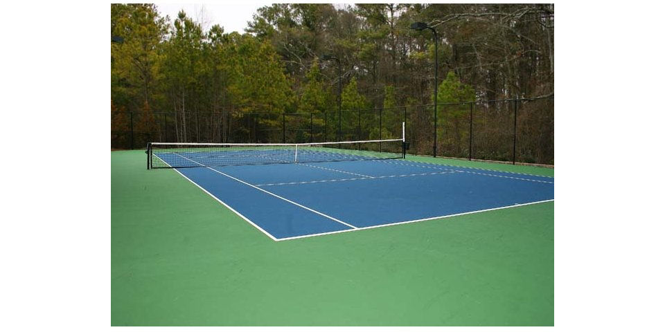 Outdoor tennis court at Villas at Loganville providing luxury sports amenities