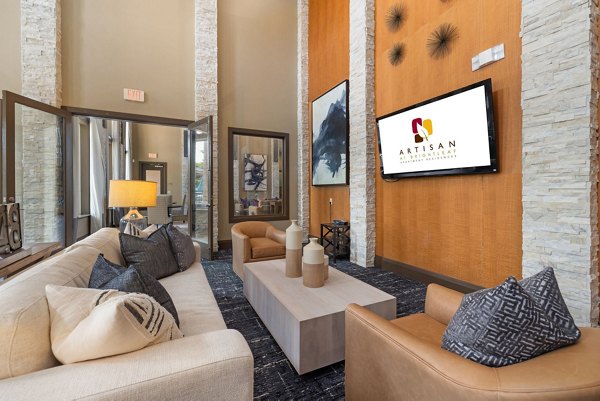 Modern lobby with contemporary art and seating at Artisan at Brightleaf Apartments