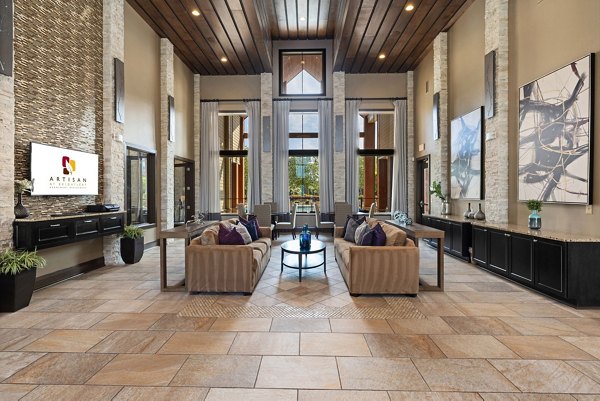Stylish clubhouse with modern decor at Artisan at Brightleaf Apartments, perfect for social gatherings and meetings