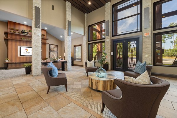 Lobby featuring contemporary design and plush seating at Artisan at Brightleaf Apartments