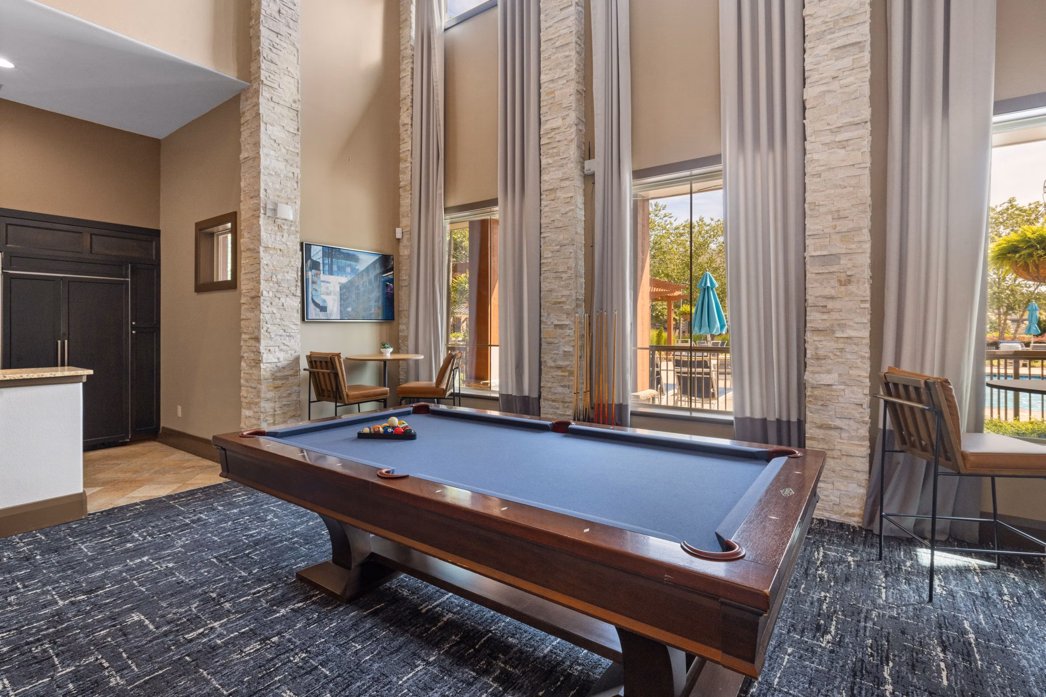 Game room featuring pool table and arcade games at Artisan at Brightleaf Apartments