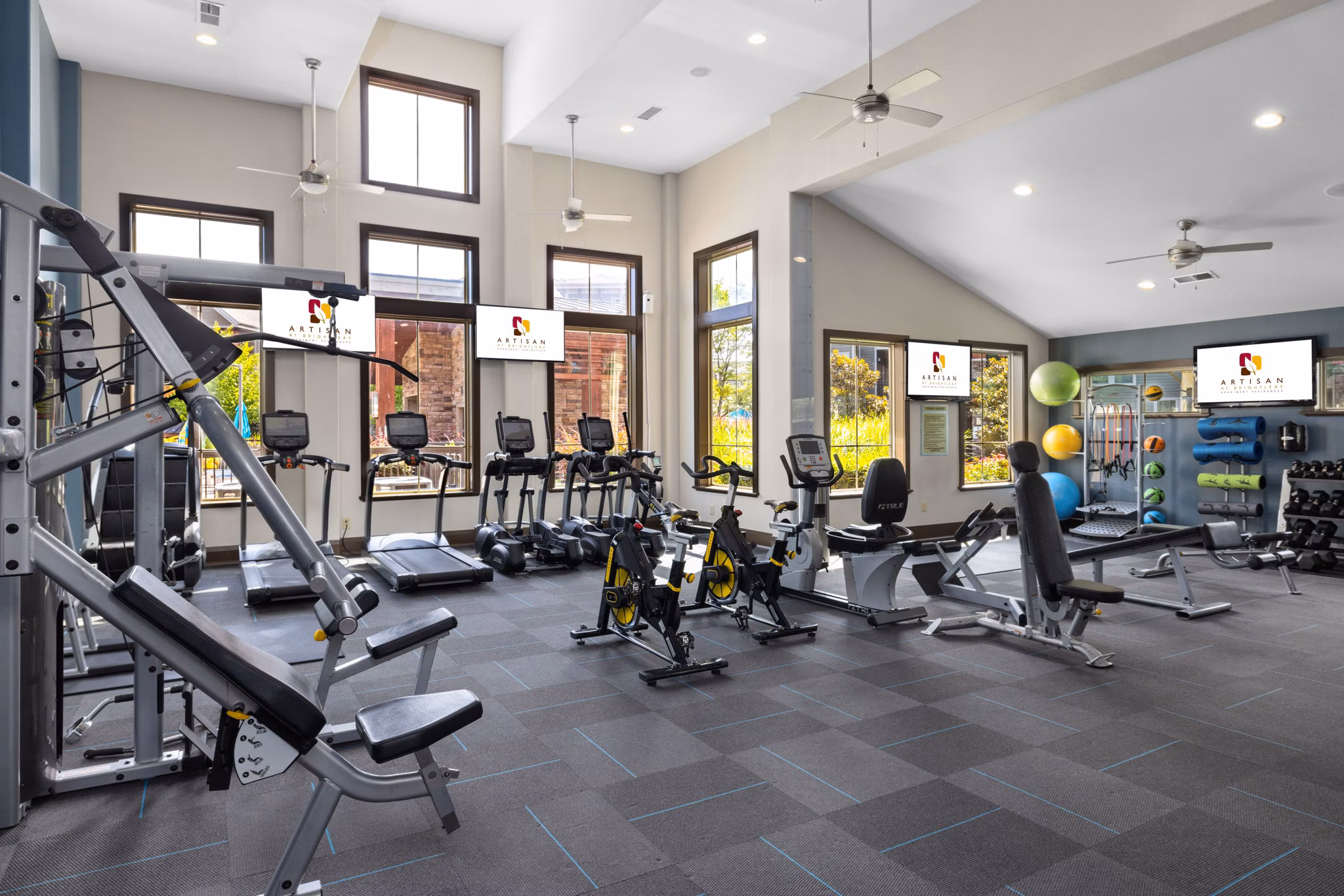 State-of-the-art fitness center featuring modern equipment at Artisan at Brightleaf Apartments