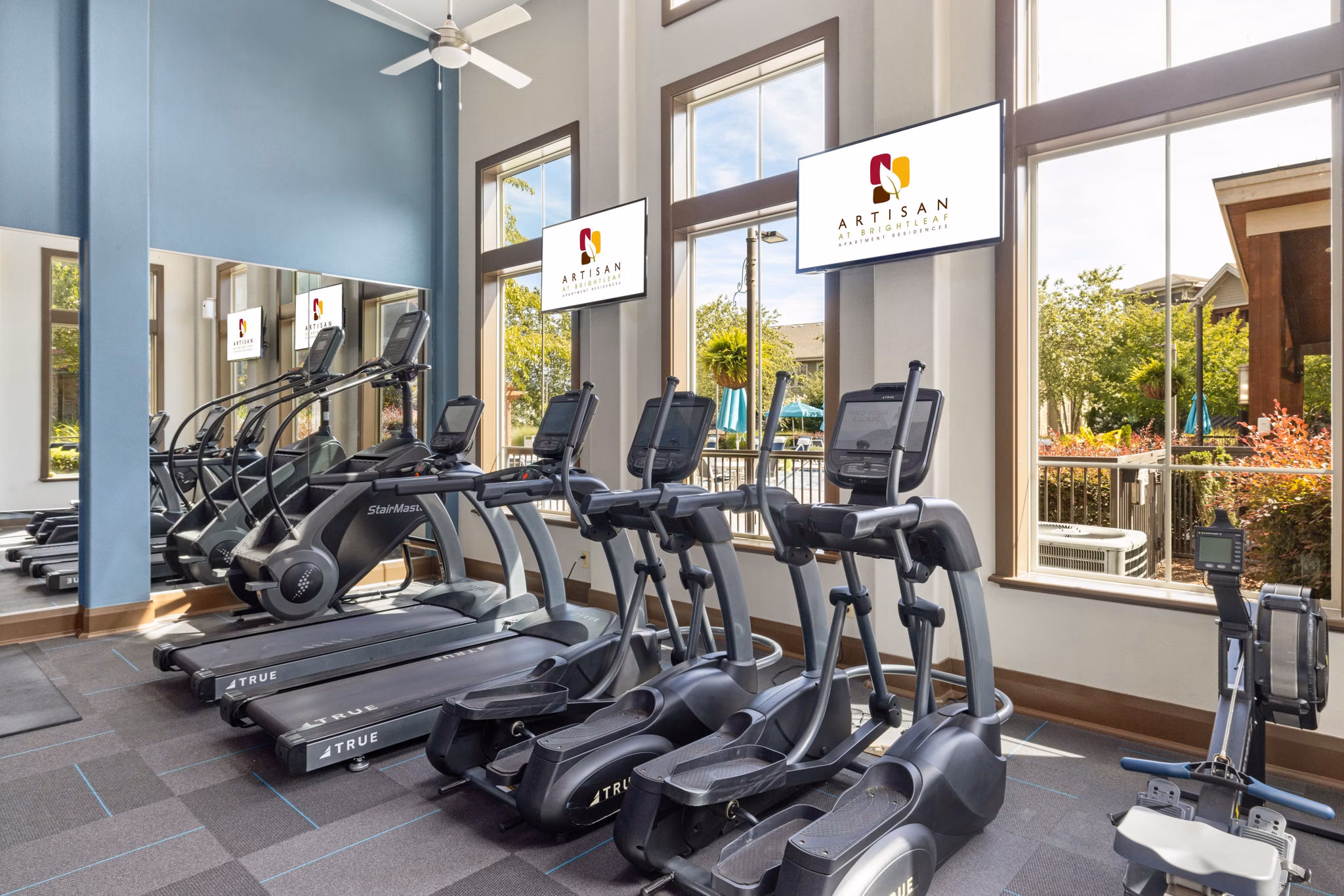 Modern fitness center with state-of-the-art equipment at Artisan at Brightleaf Apartments