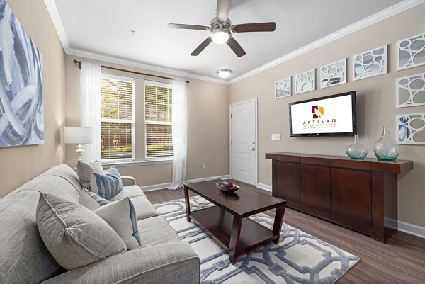 Spacious living room with contemporary decor in Artisan at Brightleaf Apartments