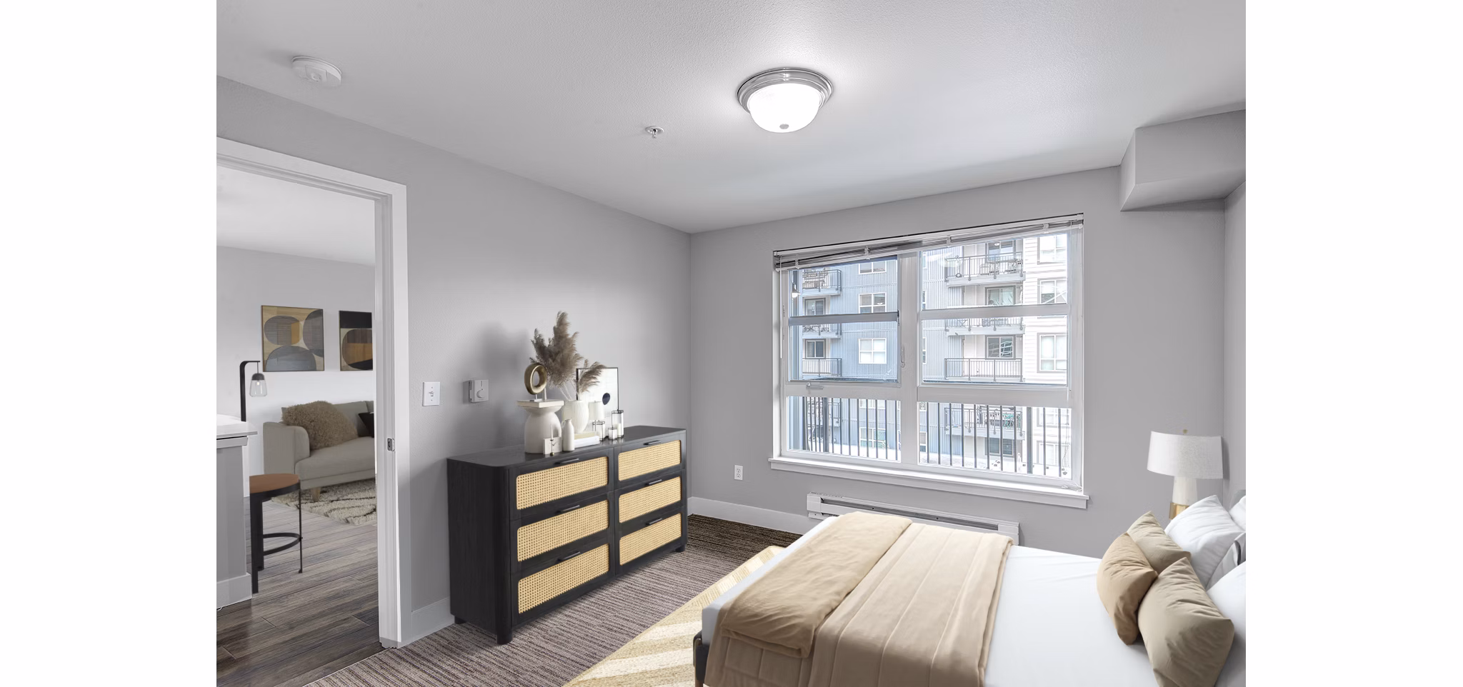 Spacious bedroom with lake views at 1611 on Lake Union Apartments, featuring modern decor and large windows