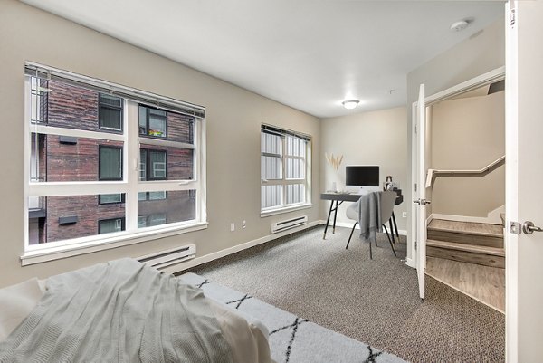 Spacious bedroom with modern design at 1611 on Lake Union Apartments, offering luxury living in a prime location