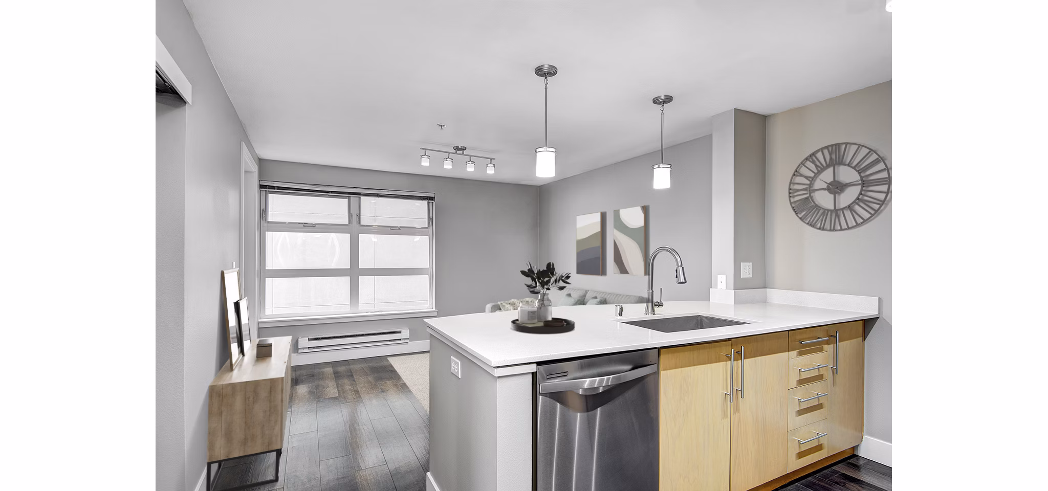 Modern kitchen with stainless steel appliances and quartz countertops at 1611 on Lake Union Apartments
