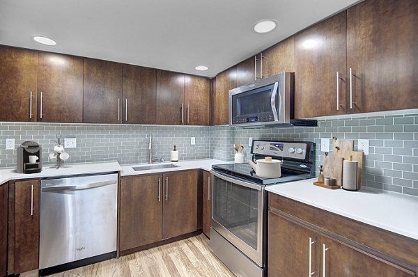 Modern kitchen with stainless steel appliances at 1611 on Lake Union Apartments