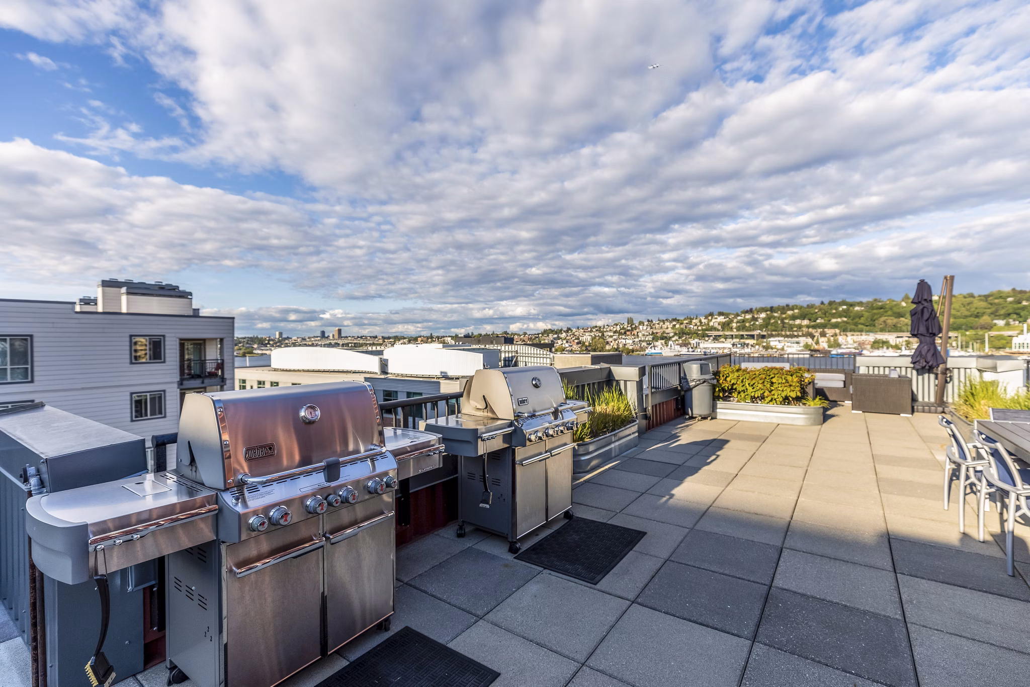 Outdoor BBQ grill area at 1611 on Lake Union Apartments, perfect for social gatherings with views of Lake Union