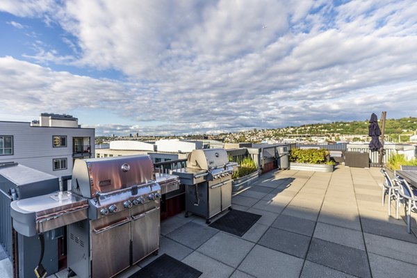 Outdoor BBQ grill area at 1611 on Lake Union Apartments, perfect for social gatherings with views of Lake Union