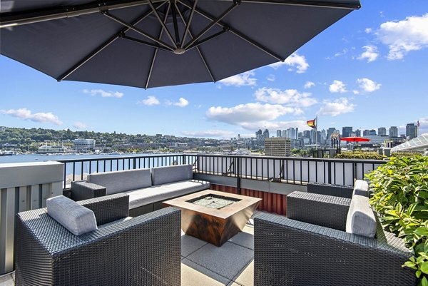 Cozy outdoor fire pit at 1611 on Lake Union Apartments offering a serene waterfront ambiance perfect for gathering and relaxation