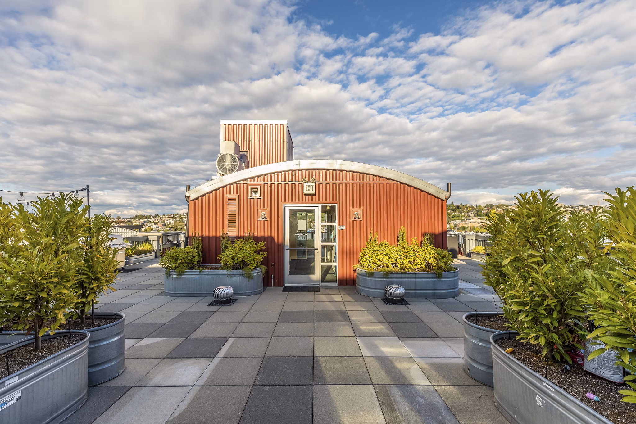 Green courtyard with seating at 1611 on Lake Union Apartments, providing a serene outdoor space in a luxury living environment