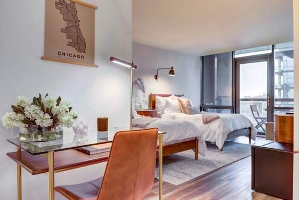 Cozy bedroom with modern dÃ©cor in SoNo East Apartments Luxurious design and ample natural light create an inviting atmosphere