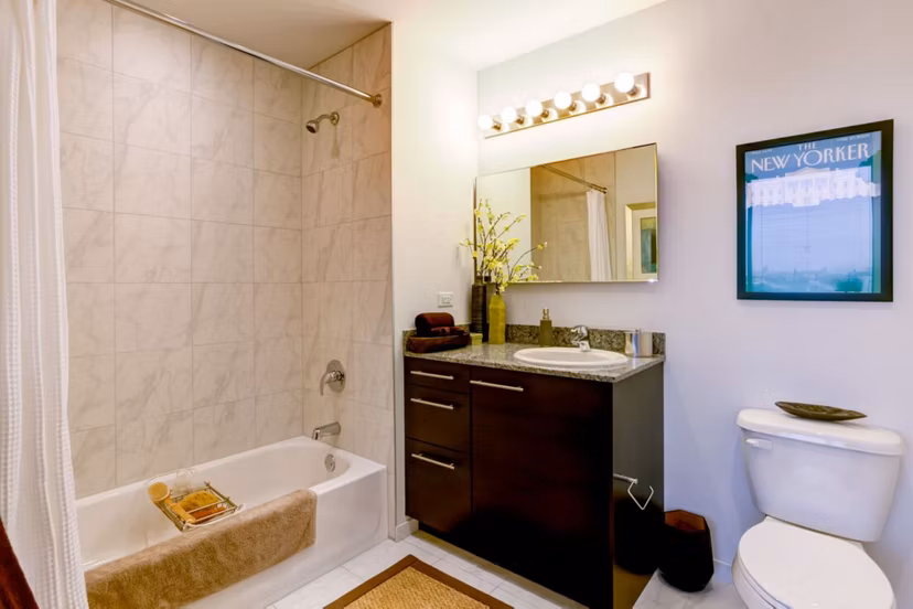 Modern bathroom with sleek fixtures at SoNo East Apartments, featuring spacious layout and contemporary design