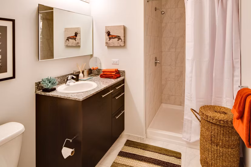 Modern bathroom featuring sleek fixtures at SoNo East Apartments in Chicago