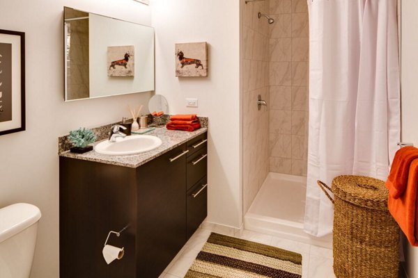 Modern bathroom featuring sleek fixtures at SoNo East Apartments in Chicago