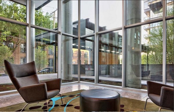 Clubhouse featuring modern design and comfortable seating at SoNo East Apartments