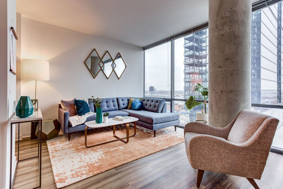 Modern living room with cozy seating and vibrant decor at SoNo East Apartments, luxury residences in central Chicago