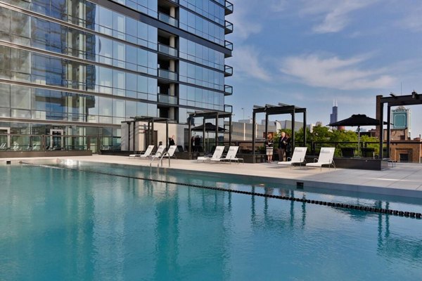 Rooftop pool with skyline views at SoNo East Apartments in Chicago